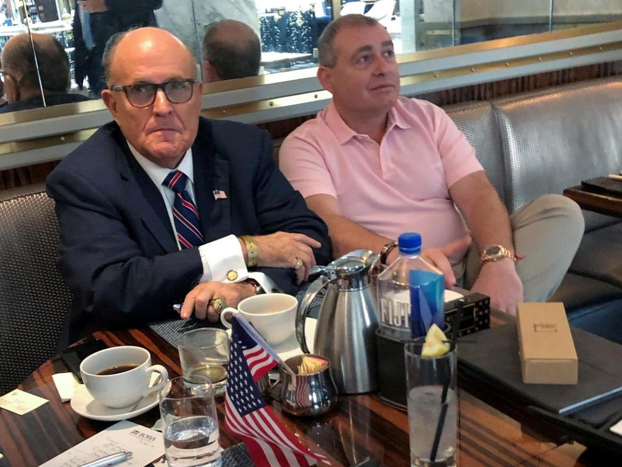 Mr Trump's personal lawyer Rudy Giuliani has coffee with Ukrainian-American businessman Lev Parnas: Reuters