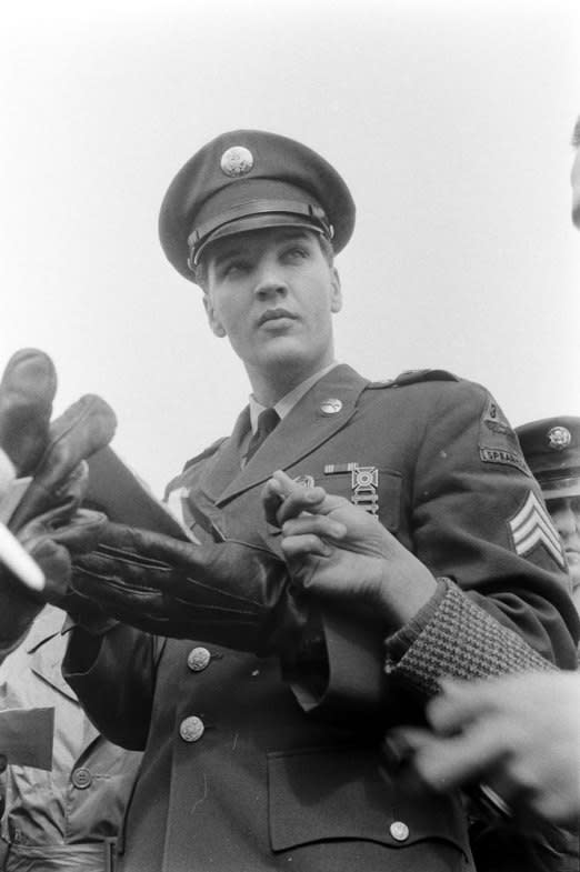 Not originally published in LIFE. Elvis Presley at Fort Dix, New Jersey, shortly before his discharge from the U.S. Army, March 1960. (Al Fenn—Time & Life Pictures/Getty Images) <br> <br> <a href="http://life.time.com/culture/elvis-presley-life-photos-of-the-king-leaving-the-army-march-1960/#1" rel="nofollow noopener" target="_blank" data-ylk="slk:Click here to see the full collection at LIFE.com;elm:context_link;itc:0;sec:content-canvas" class="link ">Click here to see the full collection at LIFE.com</a>