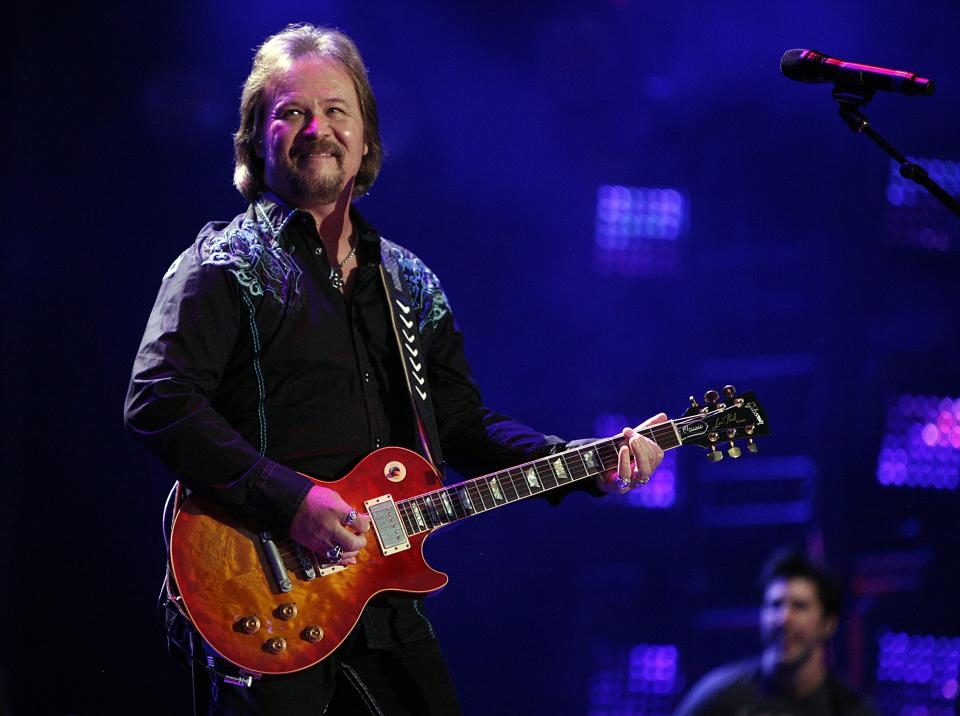 In this Friday, June 6, 2014 file photo, Travis Tritt performs during the CMA Fest at LP Field in Nashville, Tenn. Country music star Tritt says his tour bus was "sideswiped" in a multi-vehicle crash that left several people dead in South Carolina. News outlets report the crash occurred early Saturday, May 18, 2019, on Highway 22 in Horry County. (Photo by Wade Payne/Invision/AP, File)