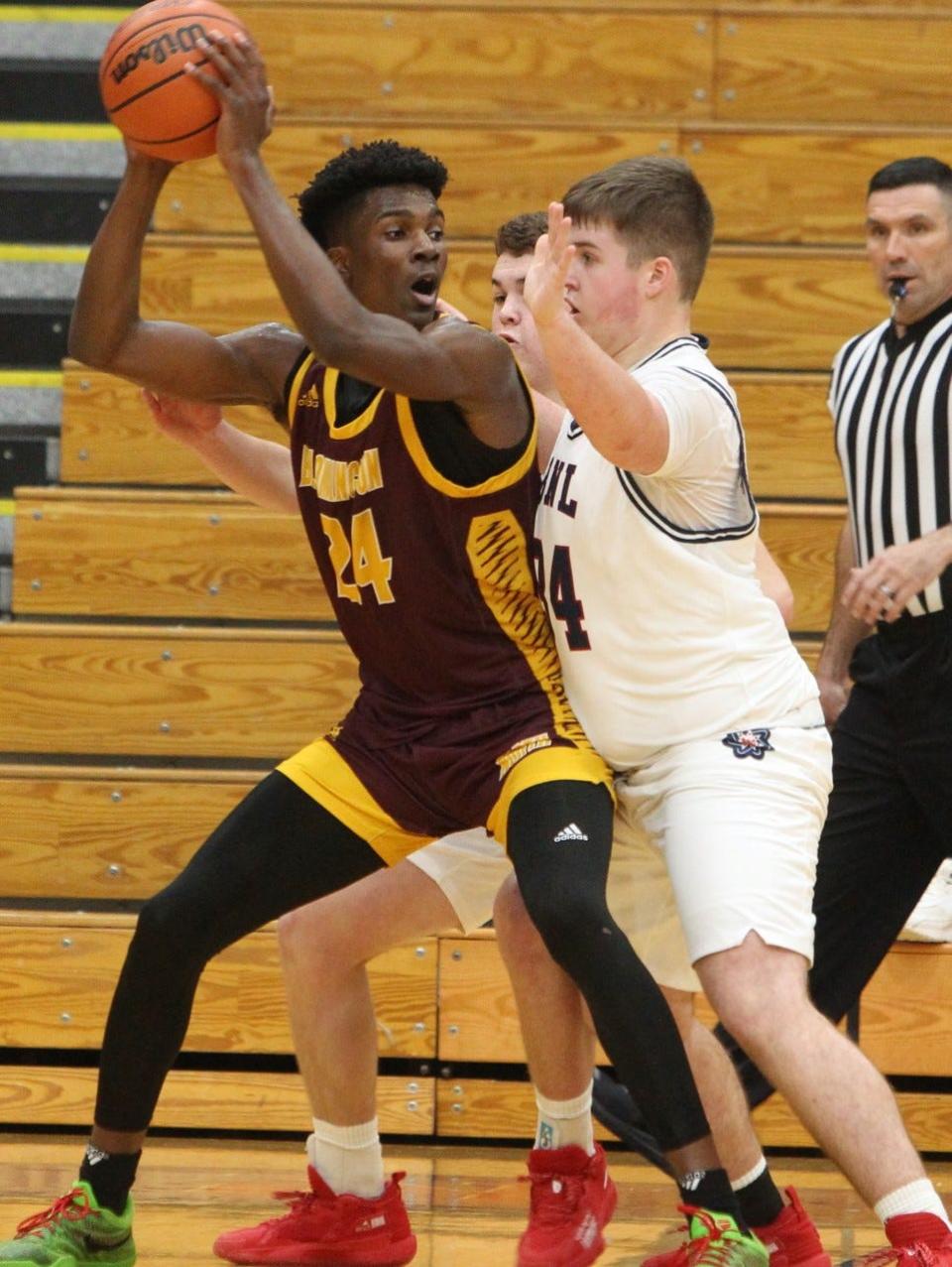 BNL's Jett Jones bodies up on Bloomington North star JaQualon "JQ" Roberts Tuesday nigth. Jones limited Roberts to 10 points in the Stars' 48-40 win.