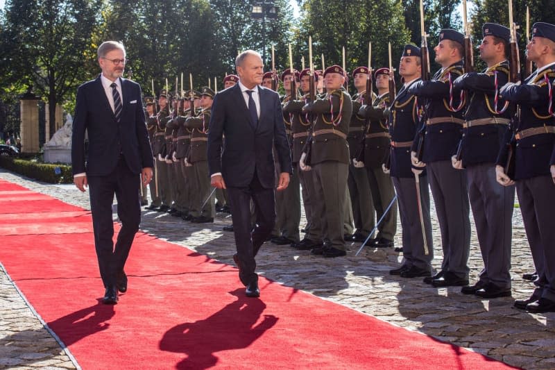 Czech Prime Minister Petr Fiala receives Polish Prime Minister Donald Tusk during a welcome ceremony in the garden of the Straka Academy, ahead of talks between the Czech and Polish governments in Prague. Barbora Vizváryová/TASR/dpa