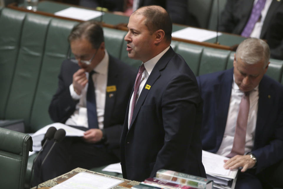 In this Sept. 12, 2019, photo, Australian Treasurer Josh Frydenberg addresses Parliament in Canberra, Australia. Lawyers for Frydenberg and for Gladys Liu, the first Chinese-born lawmaker, to be appointed to Australia's Parliament have appeared in a court to fight challenges to their elections over misleading Chinese-language campaign signs. (AP Photo/Rod McGuirk)