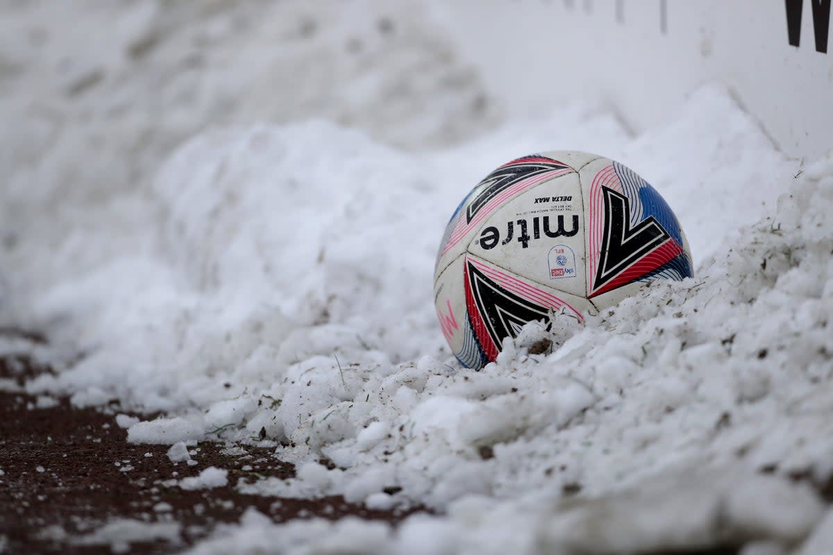 A view of a ball in the pitch side snow (Richard Sellers/PA) (PA Archive)