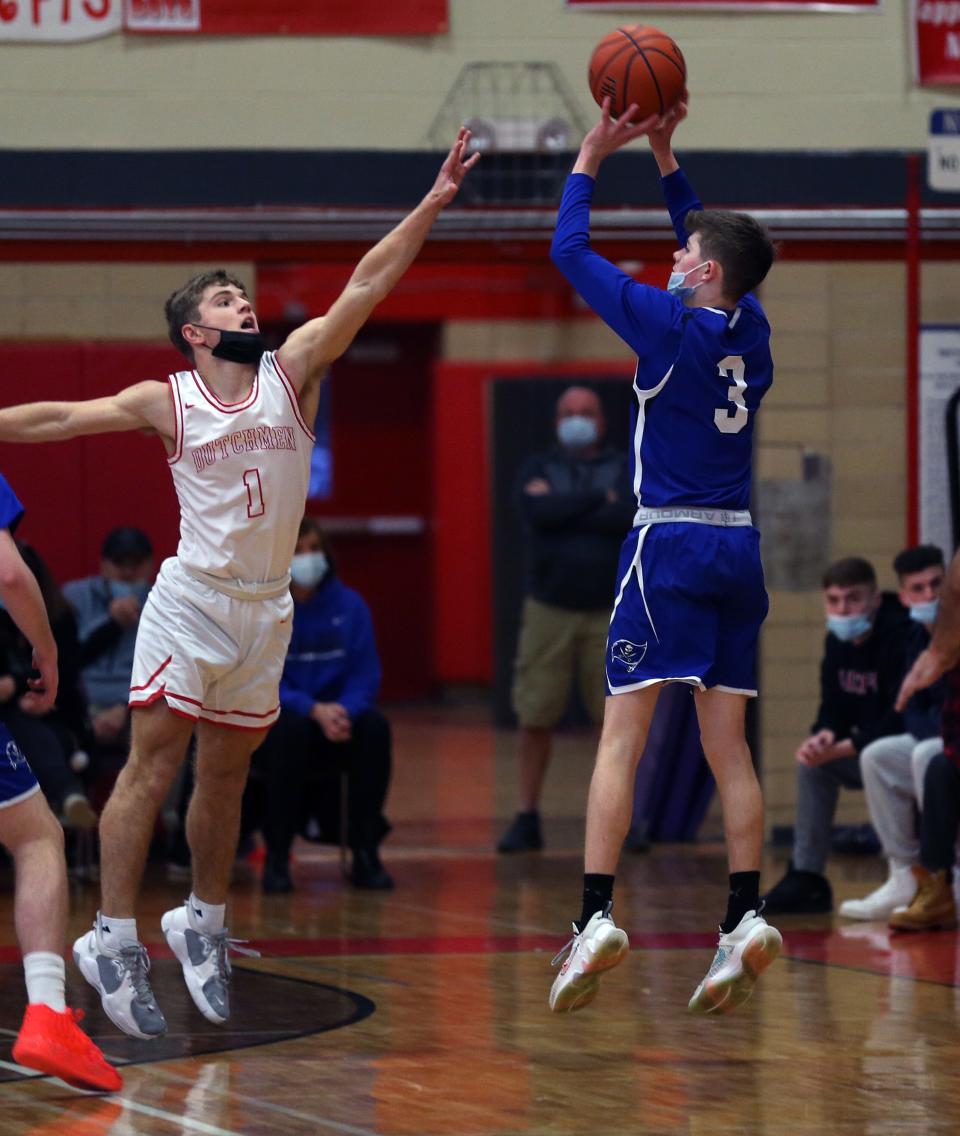 Pearl River's John Ranaghan (3) puts up a 3-point shot in front of Tappan Zee's Sean Berrigan (1) during boys basketball action at Tappan Zee High School Jan. 20, 2022. 