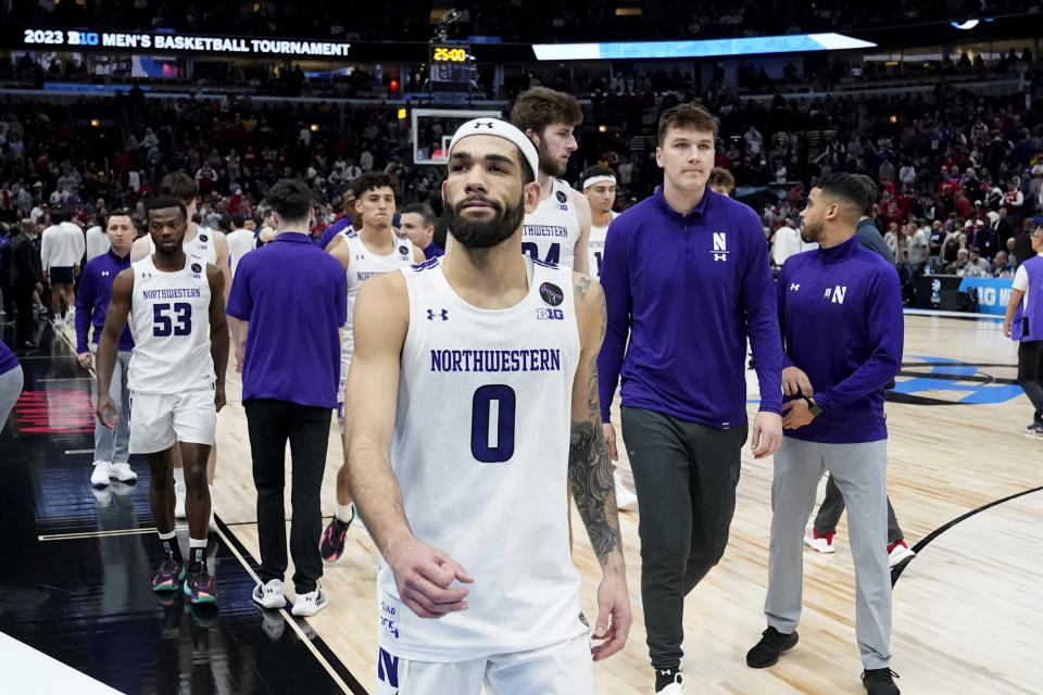 Northwestern's Boo Buie walks off the court after his team's 67-65 overtime loss to Penn State in an NCAA college basketball game at the Big Ten men's tournament, Friday, March 10, 2023, in Chicago. (AP Photo/Charles Rex Arbogast)