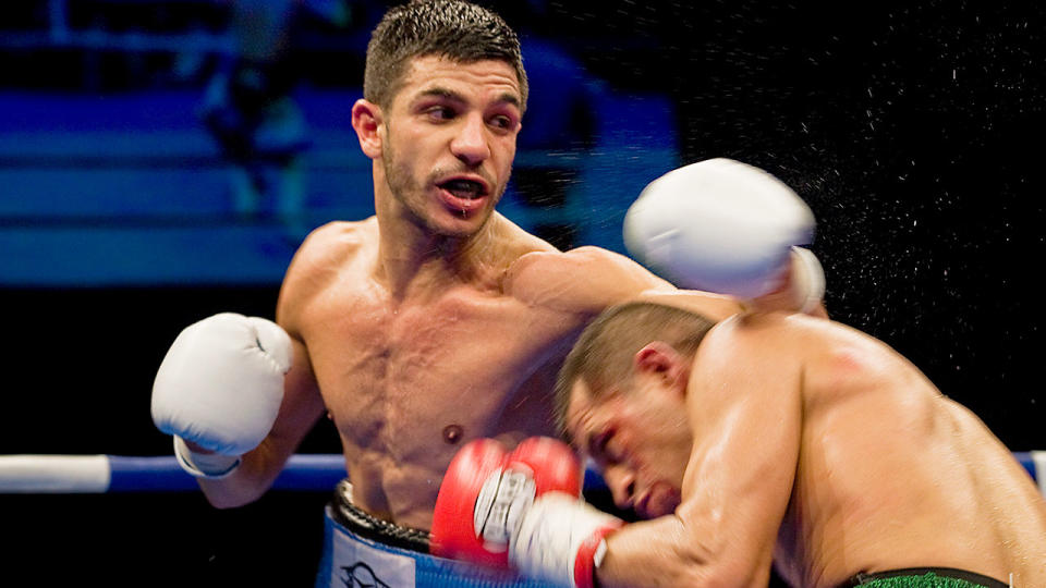 Billy Dib (left) lands a punch on Jorge Lacierva of Mexico in their IBF World Featherweight Title fight in Sydney in 2011. Pic: AAP
