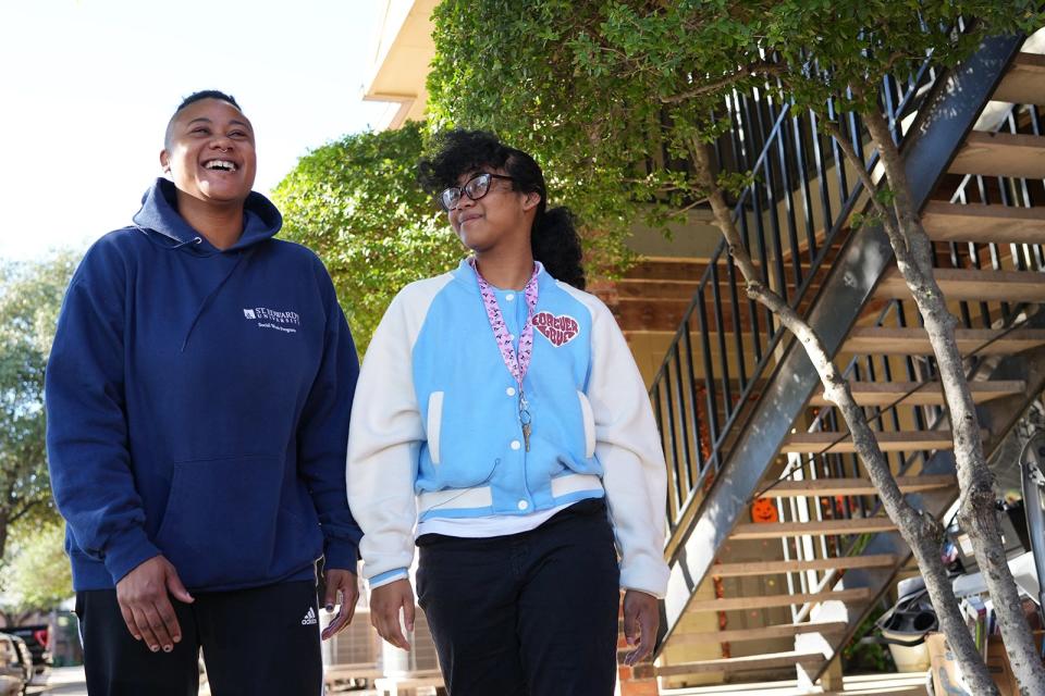 Jae Lee and his daughter, Tiare Lee, 13, walk outside their South Austin apartment. Jae Lee was nominated to Season for Caring by Foundation Communities.