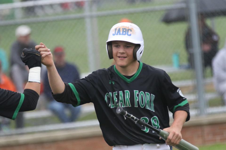 Clear Fork's Luke Schlosser is all smiles after the Colts put up 13 runs in the first inning of their win over Mansfield Senior on Wednesday.