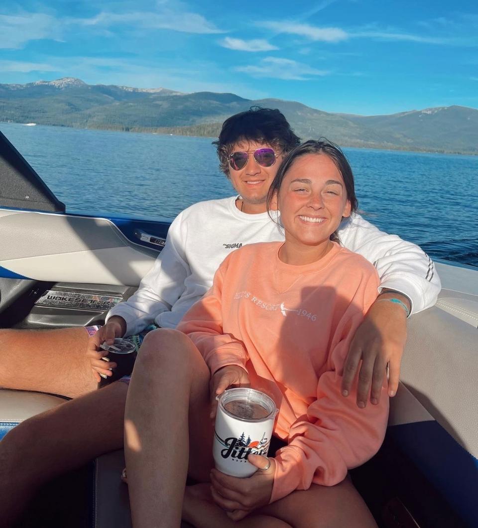 This July 2022 photo provided by Jazzmin Kernodle shows University of Idaho students Xana Kernodle, right, and Ethan Chapin on a boat on Priest Lake, in Idaho. Both students were among four found stabbed to death in an off-campus rental home on Nov. 13. (Jazzmin Kernodle via AP)