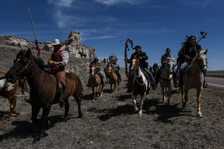 The Fort Laramie treaty riders cross the Nebraska and Wyoming border in Van Tassel, Wyoming, U.S., April 25, 2018. REUTERS/Stephanie Keith