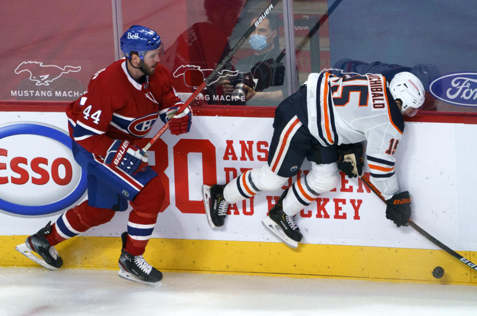 Edmonton Oilers' Josh Archibald takes a hit from Montreal Canadiens' Joel Edmundson (44) during the second period of an NHL hockey game, Tuesday, March 30, 2021 in Montreal. (Paul Chiasson/The Canadian Press via AP)