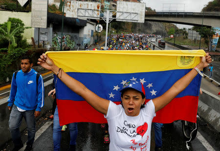 Demonstrators rally against Venezuela's President Nicolas Maduro in Caracas, Venezuela, April 13, 2017. REUTERS/Carlos Garcia Rawlins