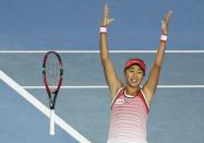 China's Zhang Shuai celebrates after winning her fourth round match against Madison Keys of the U.S. at the Australian Open tennis tournament at Melbourne Park, Australia, January 25, 2016. REUTERS/Issei Kato