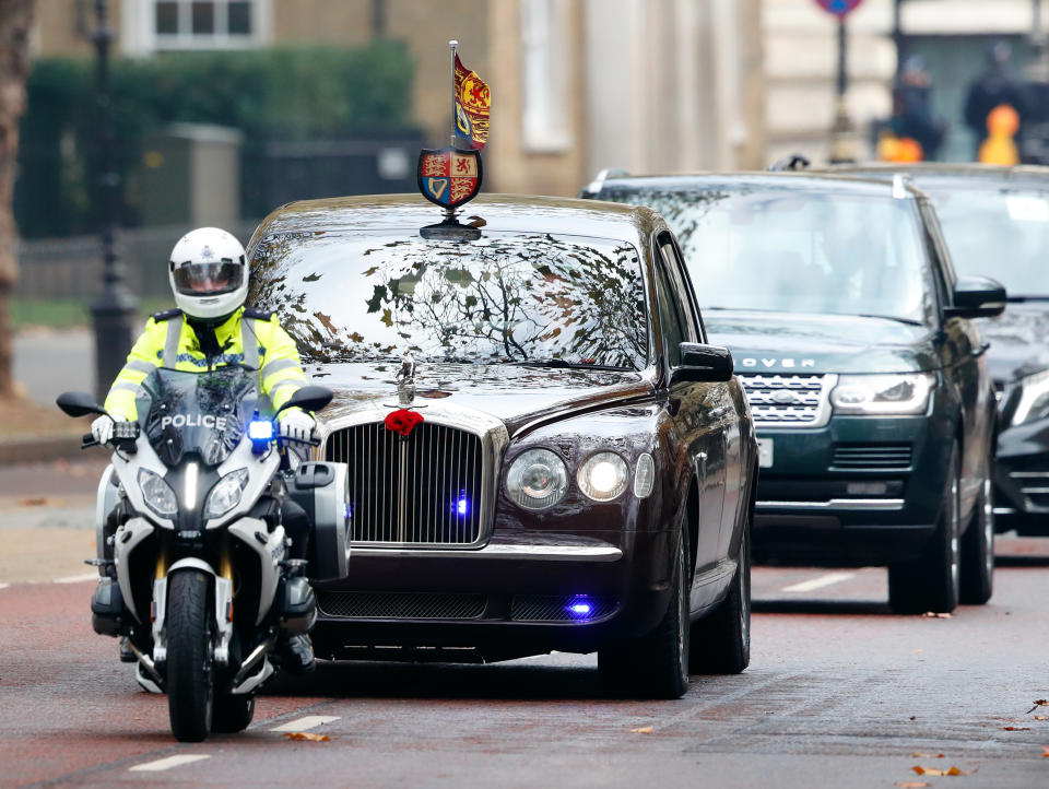 LONDON, UNITED KINGDOM - NOVEMBER 08: (EMBARGOED FOR PUBLICATION IN UK NEWSPAPERS UNTIL 24 HOURS AFTER CREATE DATE AND TIME) Queen Elizabeth II travels in her chauffeur driven Bentley car (with a motorcycle outrider of the Metropolitan Police Special Escort Group) after attending the National Service of Remembrance at The Cenotaph on November 8, 2020 in London, England. Remembrance Sunday services were substantially scaled back today due to the current restrictions on gatherings, intended to curb the spread of covid-19. (Photo by Max Mumby/Indigo/Getty Images)