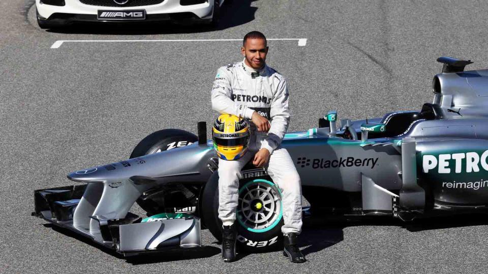 Lewis Hamilton sat on the Mercedes W03. Jerez February 2013. Credit: PA Images