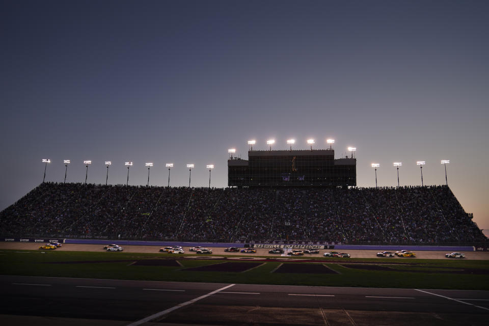 Drivers compete during a NASCAR Cup Series auto race under the lights, Sunday, June 25, 2023, in Lebanon, Tenn. (AP Photo/George Walker IV)