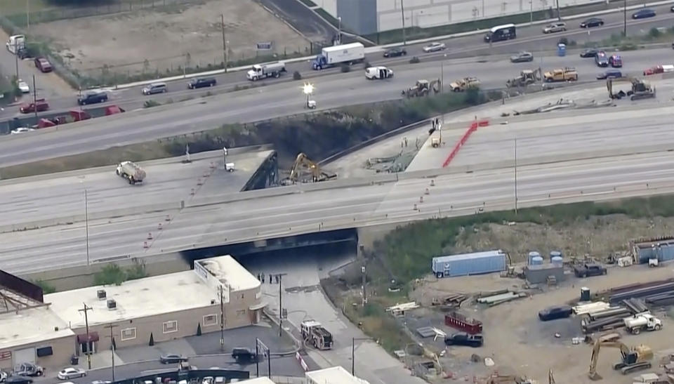 This screen grab from video provided by WPVI-TV/6ABC shows the collapsed section of I-95 as crews continue to work on the scene in Philadelphia, Monday, June 12, 2023. Detoured traffic is seen above. (WPVI-TV/6ABC via AP)