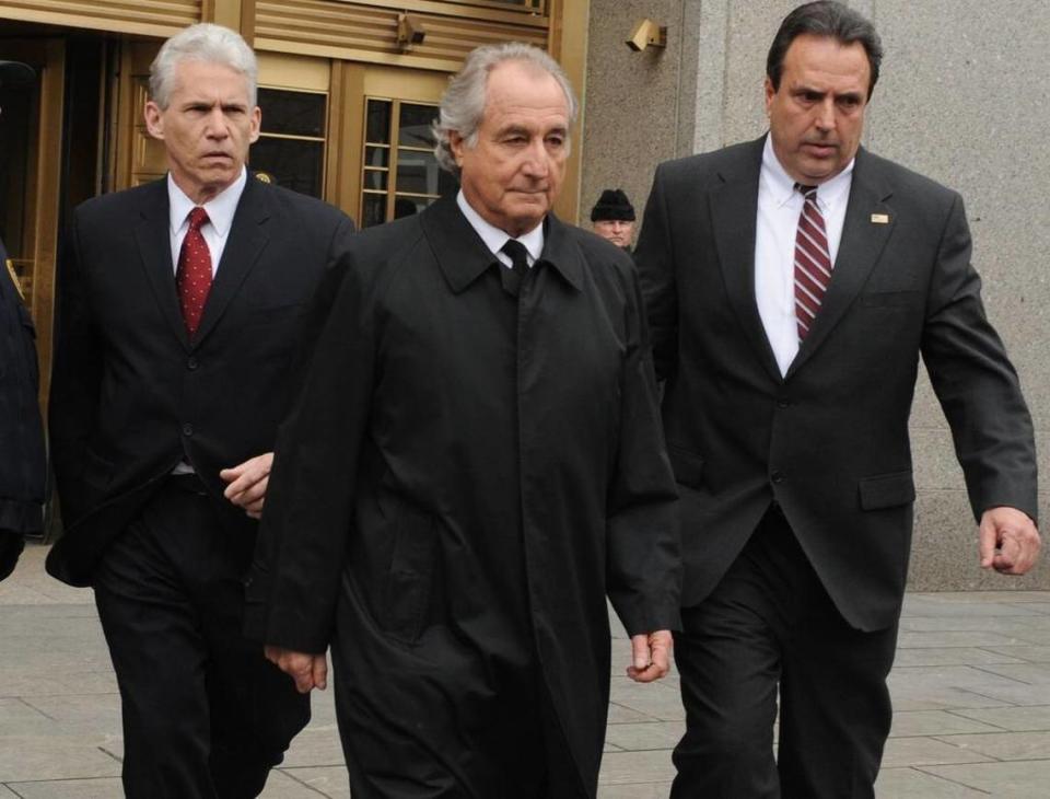 In this March 10, 2009, file photo, Bernard Madoff exits Manhattan federal court in New York. Federal regulators reached a settlement with Madoff on June 16, 2009, that prohibits him from working in the securities industry.