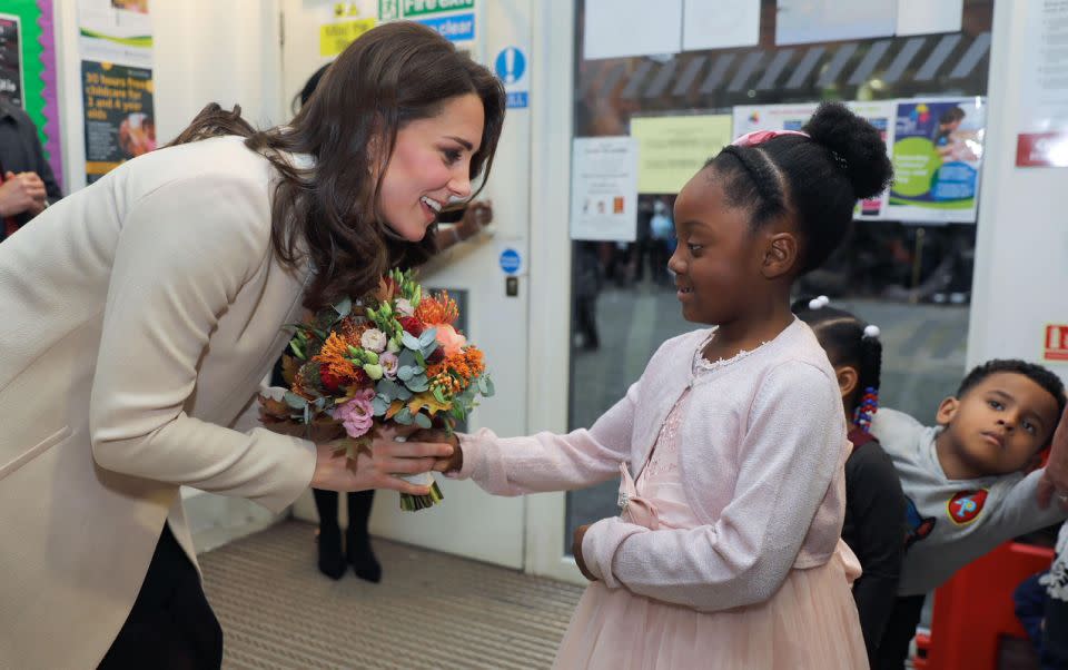 Kate played and painted with little kids at the centre and was reportedly heard saying that kids’ activities are the “best fun”. Photo: Getty Images