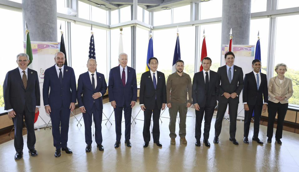 President Joe Biden, fourth from left, and Ukrainian President Volodymyr Zelenskyy, fifth from right, and other G7 leaders pose for a photo before a working session on Ukraine during the G7 Summit in Hiroshima, Japan, Sunday, May 21, 2023. Other leaders from right to left, European Commission President Ursula von der Leyen, Britain's Prime Minister Rishi Sunak, Canada's Prime Minister Justin Trudeau, France's President Emmanuel Macron, Zelenskyy, Japan's Prime Minister Fumio Kishida, Biden, German Chancellor Olaf Scholz, and European Council President Charles Michel and Gianluigi Benedetti, Italian ambassador to Japan. (Kyodo News via AP, Pool)