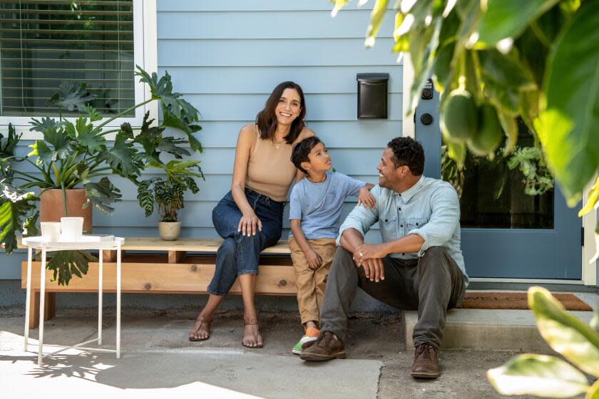 LOS ANGELES, CA - AUGUST 31: Portrait of Alex Morgan, Nicole Lemoine and the couples son Xavier outside their 300 square foot ADU in Mid-City on Thursday, Aug. 31, 2023 in Los Angeles, CA. (Mariah Tauger / Los Angeles Times)