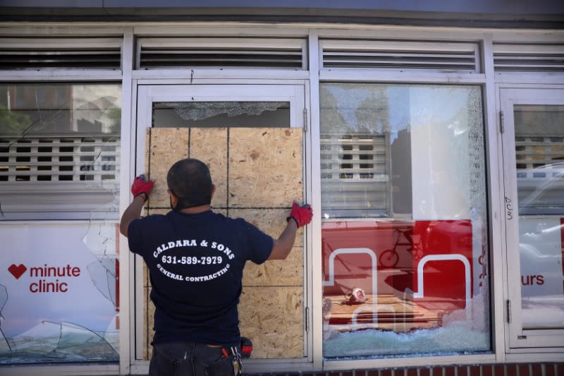 Damaged storefronts are seen during nationwide unrest following the death in Minneapolis police custody of George Floyd in Manhattan