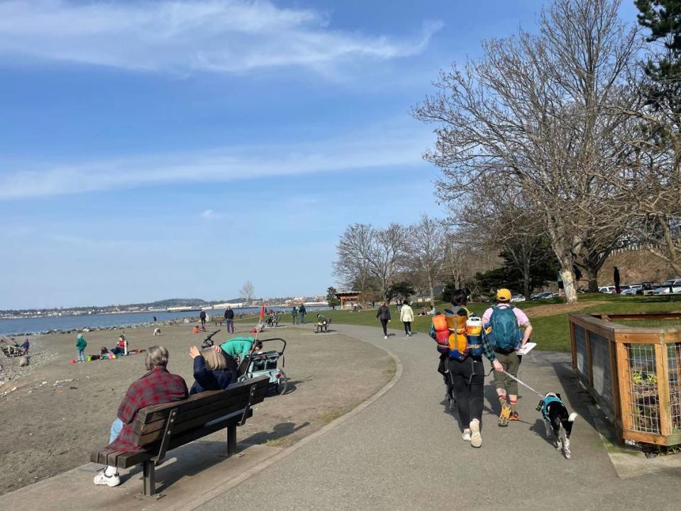 Walkers and others enjoy the sunshine Friday, March 17, 2023, at Boulevard Park on Bayview Drive in Bellingham, Wash. The park is open 6 a.m. to 10 p.m. daily.