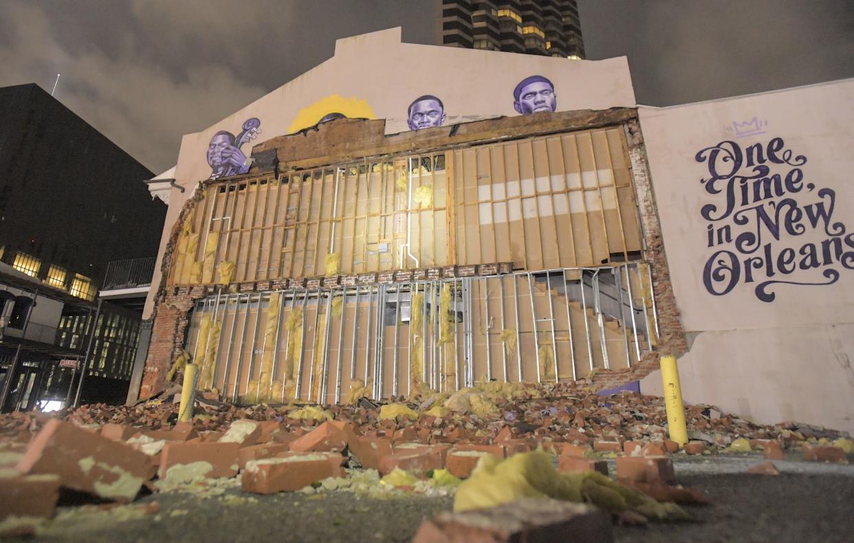 The remains of the Buddy Bolden mural on the wall of The Little Gem Saloon are seen on S. Rampart St. in New Orleans, La., early Monday, Aug. 30, 2021. Hurricane Ida became a tropical storm as its top winds slowed over Mississippi on Monday, while across southeast Louisiana residents waited for daylight to be rescued from floodwaters and see how much damage was caused by one of the most powerful hurricanes ever to strike the U.S. mainland. All of New Orleans lost power right around sunset Sunday, leading to an uneasy night of pouring rain and howling winds.