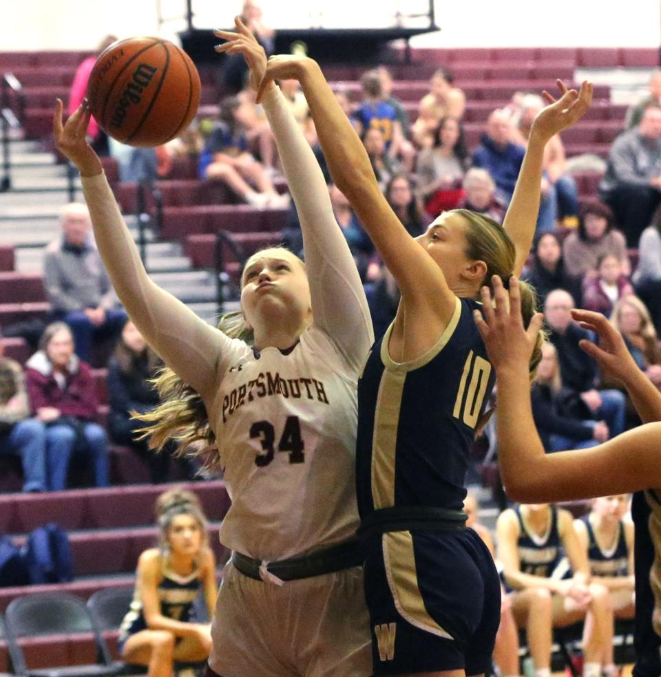 Portsmouth's Maddie MacCannell goes up strong for a rebound against Windham's Paige Carboni Jan. 30, 2024.