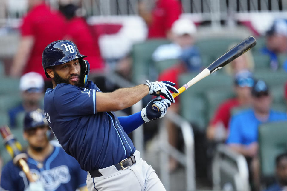 Tampa Bay Rays' Amed Rosario drives in a run with a double in the first inning of a baseball game against the Atlanta Braves Friday, June 14, 2024, in Atlanta. (AP Photo/John Bazemore)