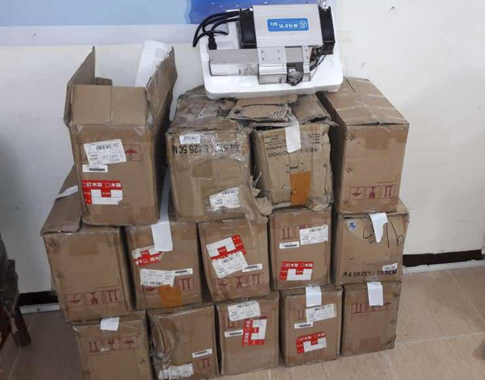 This undated photo provided by the Police News Agency, shows boxes of machinery used in Bitcoin "mining" operations that were confiscated by police in Nazarabad, Iran. Squeezed by sanctions and fueled by subsidized electricity, Iranians and others lured to the country increasingly are turning to Bitcoin and other digital cryptocurrencies. Some mine for the currency. That involves harnessing the power of their computers to verify and secure other users’ transactions around the world so that the same bitcoin isn’t spent twice. They are given new bitcoins as rewards. (News.police.ir via AP)