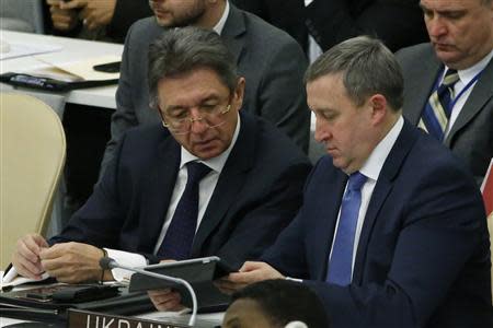 Ukraine's acting Minister of Foreign Affairs Andrii Deshchytsia (R) speaks with Ukraine's U.N. Ambassador Yuriy Sergeyev before the vote count of a draft resolution on the territorial integrity of the Ukraine at the U.N. headquarters in New York March 27, 2014. REUTERS/Eduardo Munoz