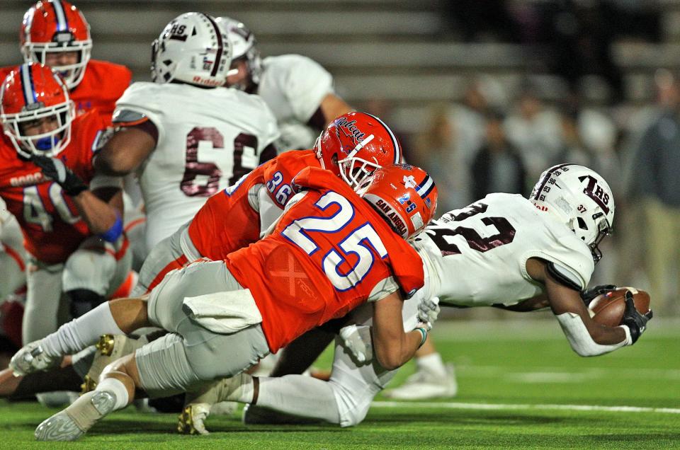 Evan Arnold (36) and Jayden Limon (25) make a tackle for Central during a game against Legacy on Friday, Oct. 29, 2021.