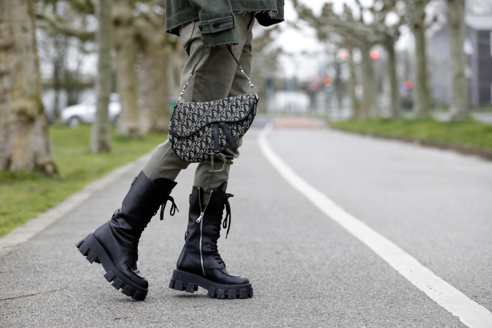 DUSSELDORF, GERMANY - MARCH 20: Black monolith boots by Prada and a Dior saddle bag as a detail of influencer Gitta Banko during a street style shooting on March 20, 2020 in Dusseldorf, Germany. (Photo by Isa Foltin/Getty Images)