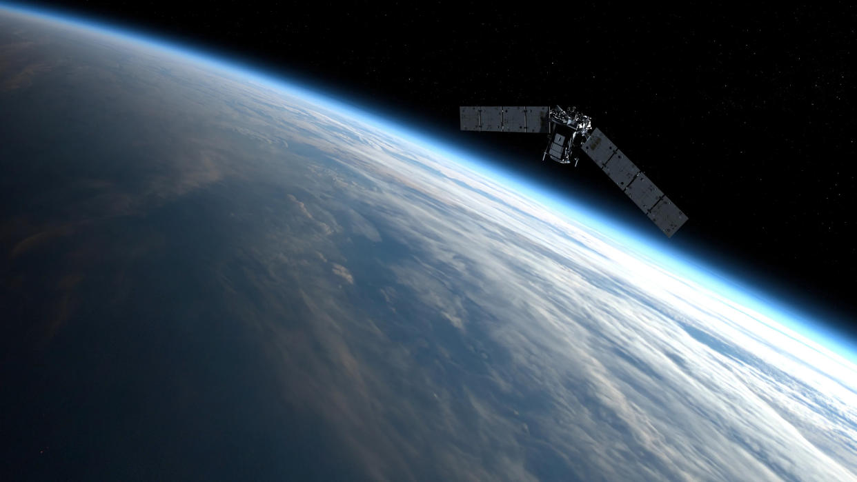  Illustration of a spacecraft orbiting earth. 