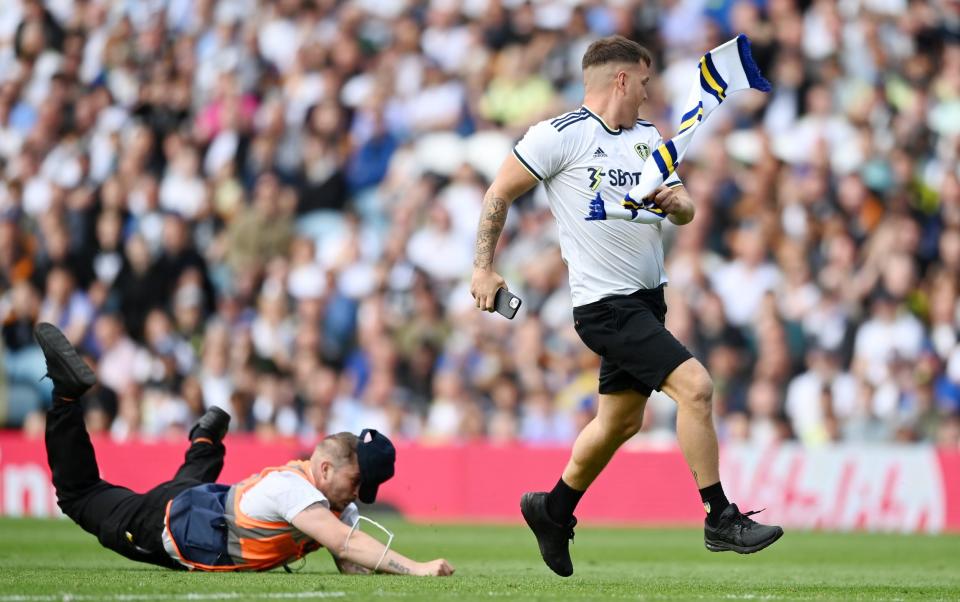 A Leeds United fan invades the pitch - Getty Images Europe