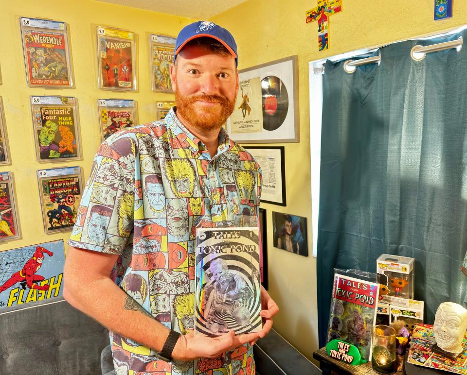 Daniel Torres, one of the co-founders of Space Chimp Comics, holds a copy of the first issue of "Tales from Toxic Pond."