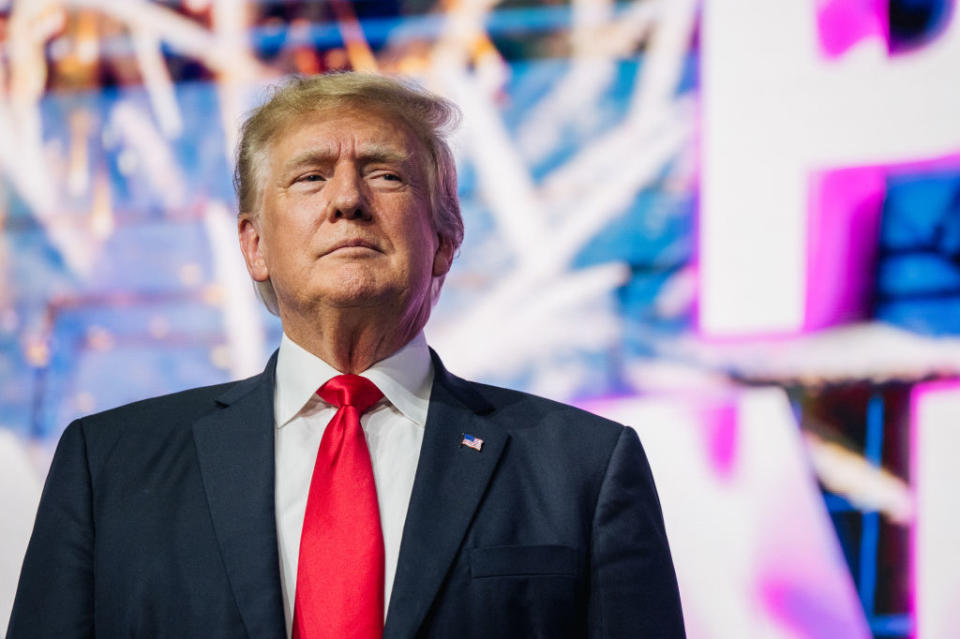 Former US President Donald Trump  makes an entrance at the Rally To Protect Our Elections conference in Phoenix, Arizona. 