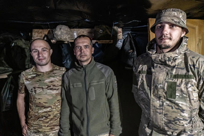 Ukrainian soldiers with an artillery crew in an underground dugout along the Donetsk frontline. Photo by Dylan Burns/UPI