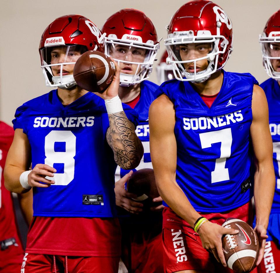 Quarterbacks Dillon Gabriel (8) and Nick Evers (7) look on during OU's first spring practice March 22 in Norman.