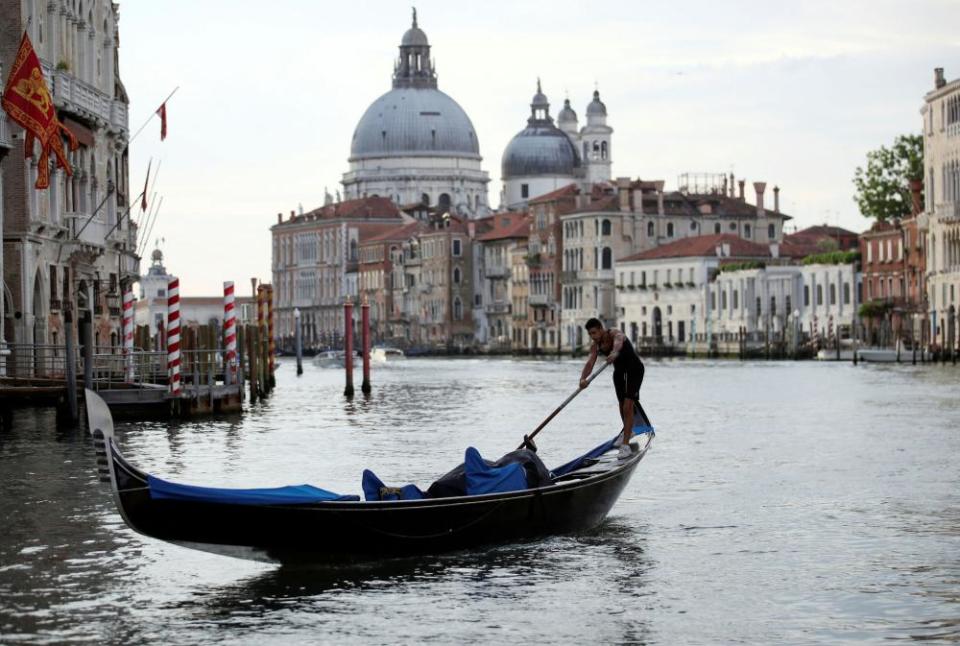 A gondolier rows on the Grand Canal in Venice on 7 June, 2021.