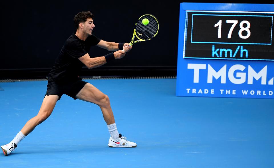 Australia's Thanasi Kokkinakis hits a return against Australia's Alex Bolt during their Murray River Open men's singles tennis match in Melbourne on February 1, 2021. 