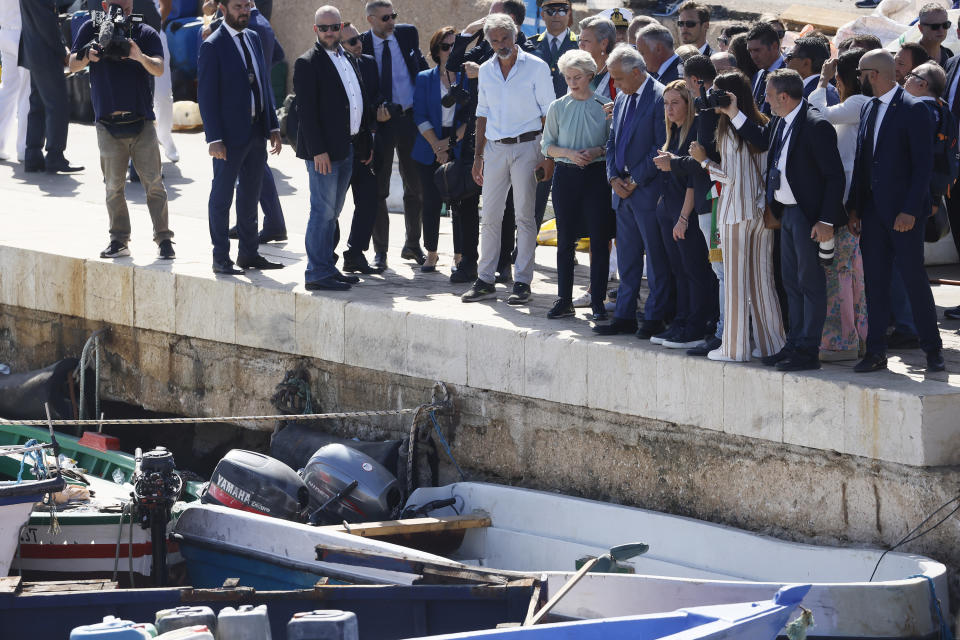 FILE - The President of the European Commission, Ursula von der Leyen, sixth from the right front row, and Italy's Premier Giorgia Meloni, fourth from the right front row, visit the island of Lampedusa, in Italy, Sunday, Sept. 17, 2023. When Giorgia Meloni took office a year ago as the first far-right premier in Italy's post-war history, concern was palpable abroad about the prospect of democratic backsliding and resistance to European Union rules. But since being sworn in as premier on Oct. 22, 2022, Meloni has confounded Western skeptics. (Cecilia Fabiano/LaPresse via AP, File)