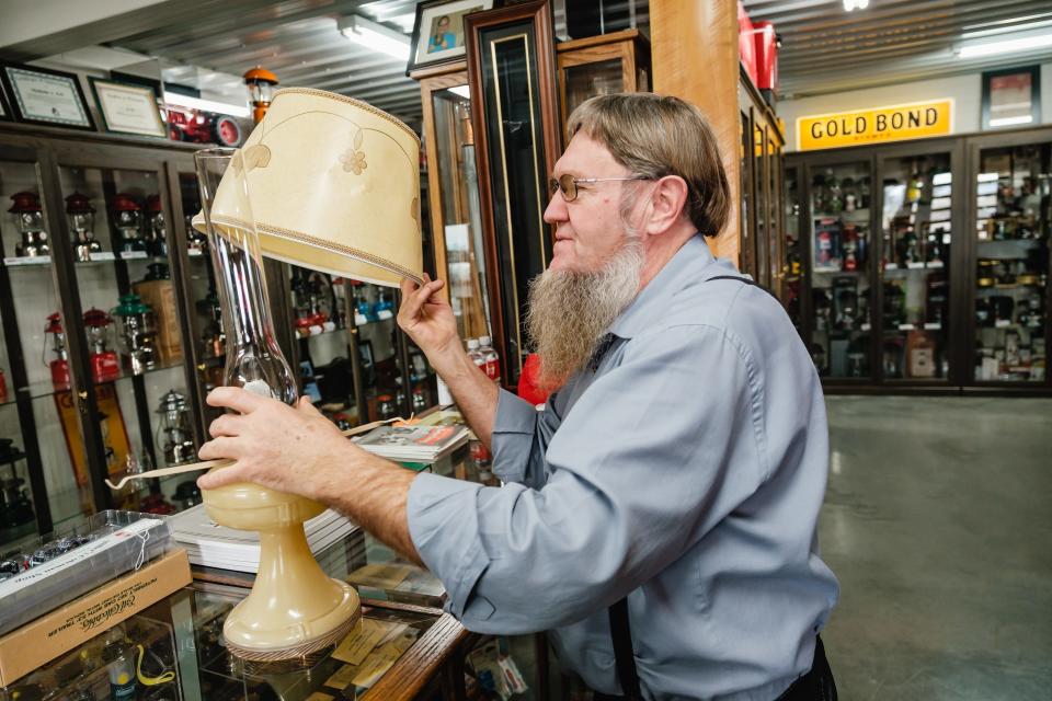 Ed Erb, owner of Erb's Coleman Museum in Sugarcreek, talks about a spirit lamp which he lights once a year in honor of people who have died.