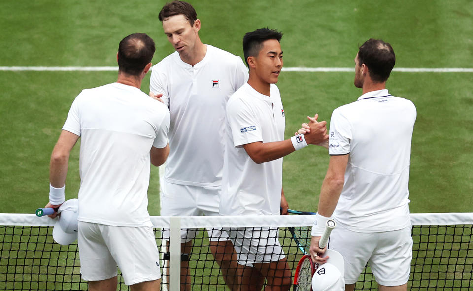 Rinky Hijikata and John Peers congratulate Andy Murray and brother Jamie at Wimbledon.