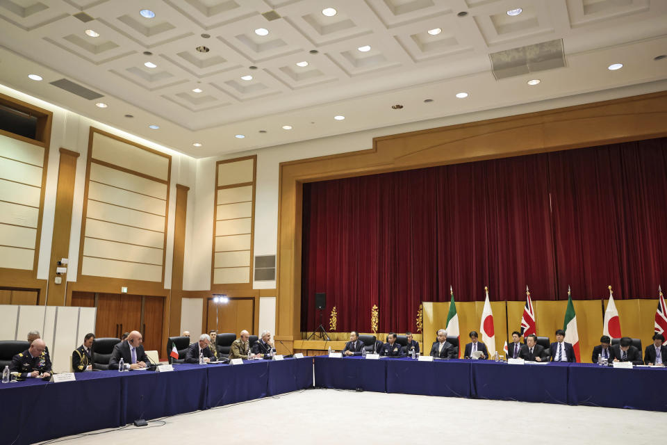 Britain's Defense Minister Ben Wallace, not in photo, Italy's Defense Minister Guido Crosetto, second left, and Japan's Defense Minister Yasukazu Hamada, fifth from right, hold a trilateral meeting Thursday, March 16, 2023 in Tokyo, Japan. (Takashi Aoyama/Pool Photo via AP)