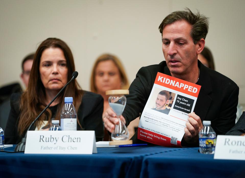 Ruby Chen, the father of Itay, an American-Israeli citizen and Israeli soldier who had been missing since the Hamas attack on Israel, places an hour glass on the table and announces time is running out on bringing the hostages held by Hamas home. Chen and wife Hagit Chen were speaking at a U.S. House roundtable on Nov. 29, 2023.