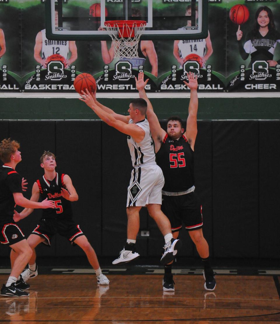 Smithville's Mac Butzer drives against Dalton's Quentin Lehman.