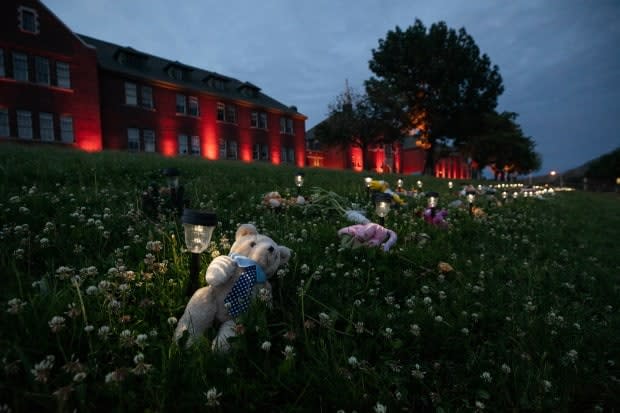 A memorial outside the former Kamloops Indian Residential School at a growing memorial to honour the 215 children whose remains have been discovered buried in Kamloops. (Ben Nelms/CBC - image credit)