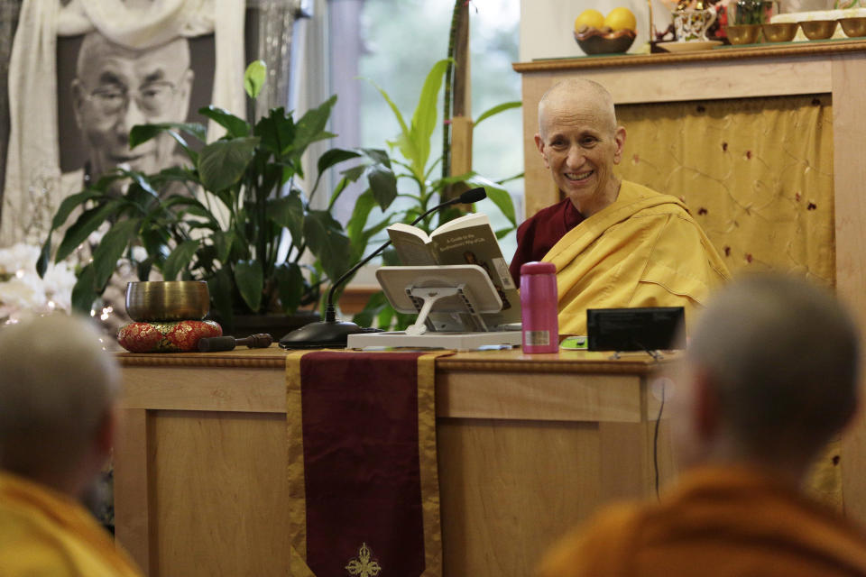 Venerable Thubten Chodron, center, a fully ordained Buddhist nun, founder and abbess of Sravasti Abbey, teaches the dharma in the monastery’s dining hall, Thursday, Nov. 18, 2021, in Newport, Wash. (AP Photo/Young Kwak)